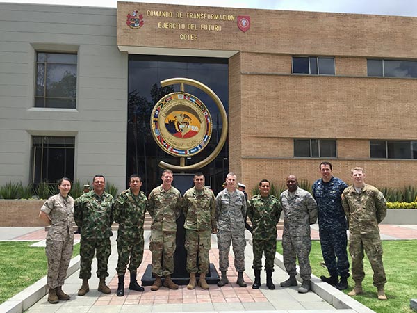 Judge advocates on the DIILS team (Maj Carina Cuellar, USMC; CPT Matt Pinckney, US Army; MAJ Norberto DaLuz, US Army; Lt Col Steve Loertscher, USAF; Maj Dan Johnson, South Carolina Air National Guard; LT Brigham Fugal, USN; CPT Tom Travers, US Army) with officers from the Colombian Ministry of Defense Human Rights Directorate during the April 2016 DIILS Operations Law Course.
